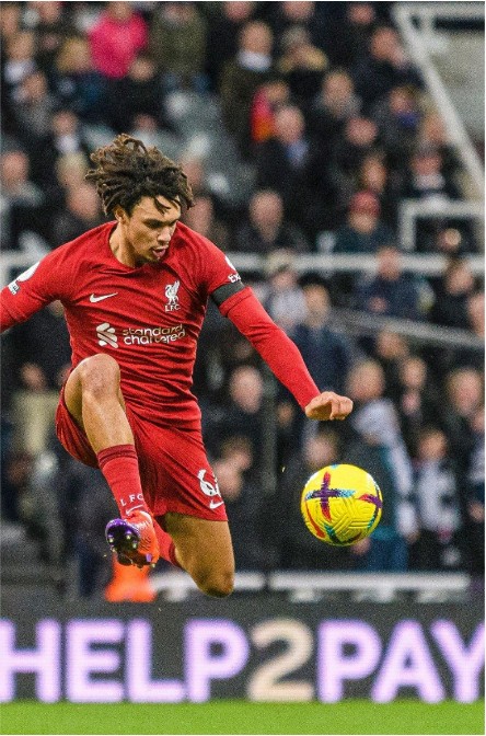 Help2Pay pitch-side LED board behind a Premier League player at St James' Park
